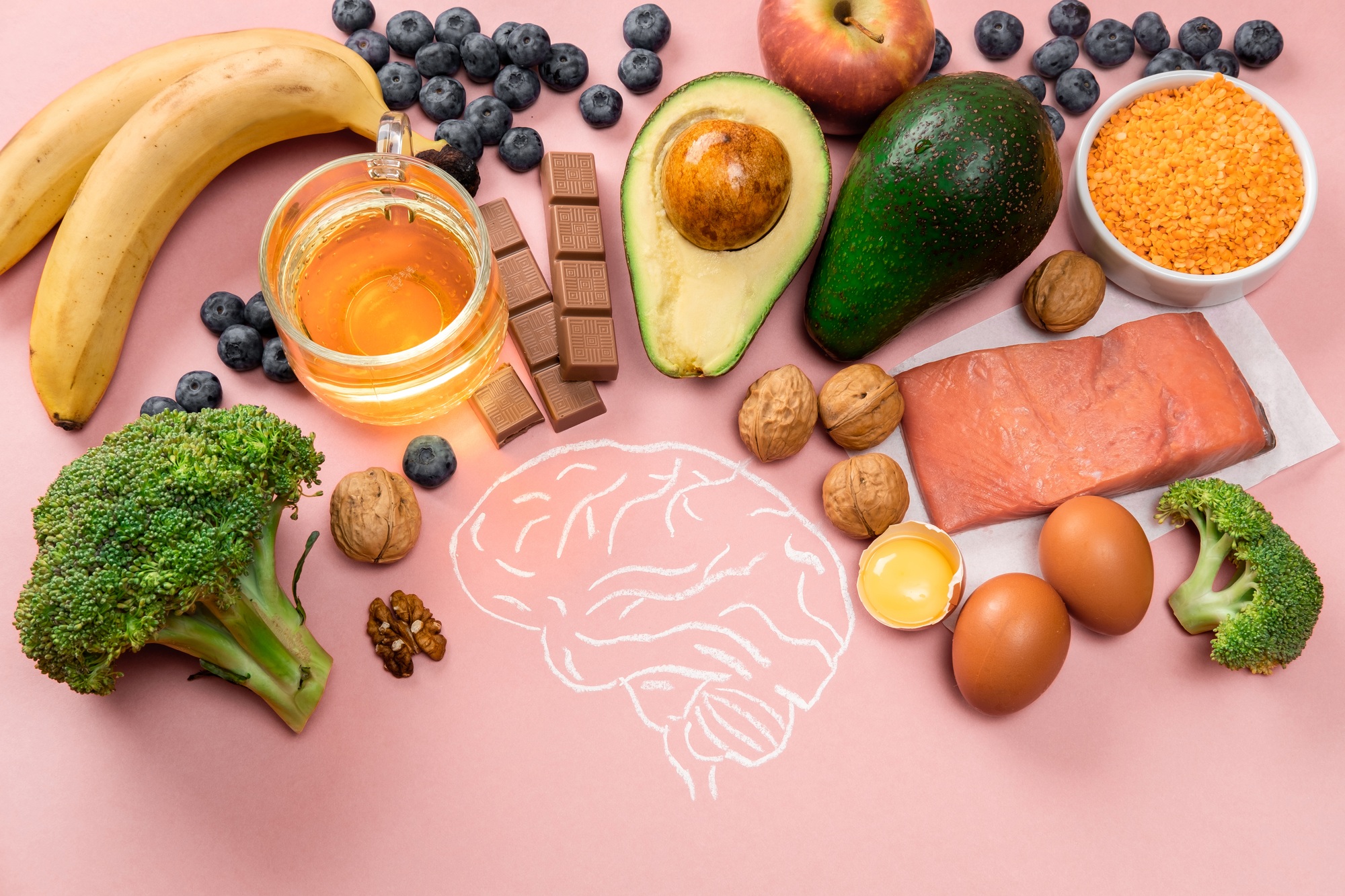 Best foods for brain and memory on pink background. Food for mind and charge of energy.